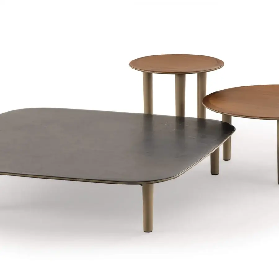 Exceptional Turri Riban coffee table with cool gray top and light brown leather detailing in a matte finish