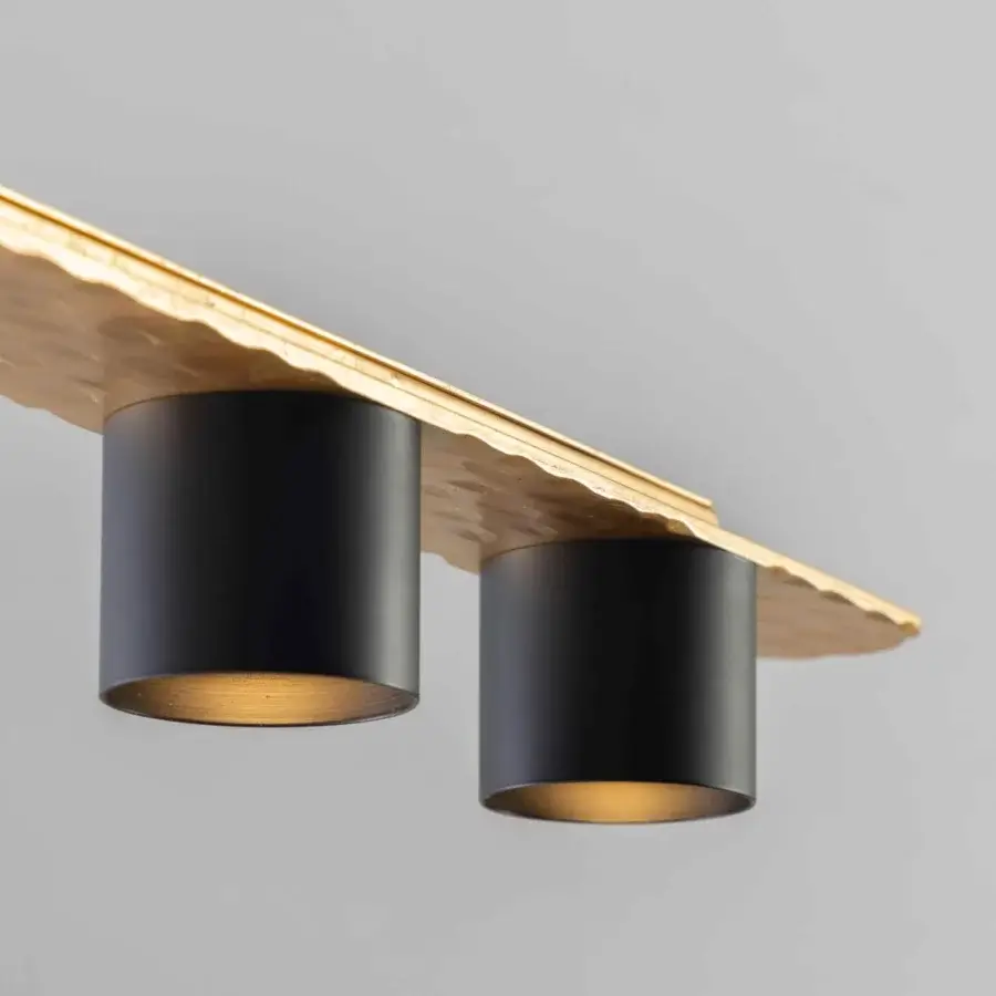 Superior Stillux Triad suspension lamp with a hammered gold tone metal bar and cylindrical matte black illuminating points