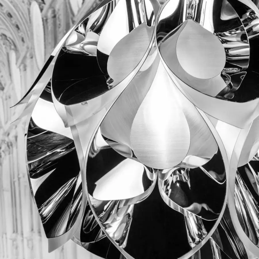 Distinguished Slamp Flora lamp suspension crafted with sixty petal-like forms in reflective silver and innovative aluminum vaporization finish