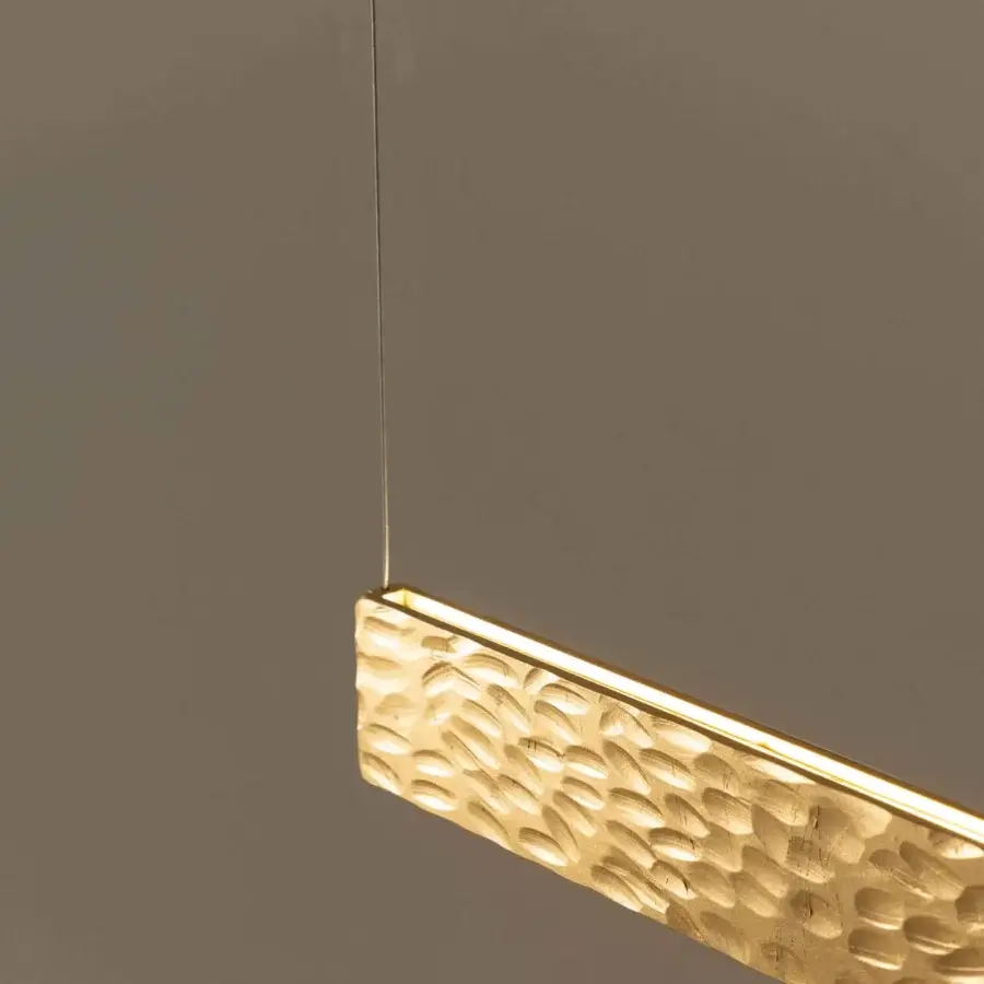 Superior Stillux Triad suspension lamp with a hammered metal bar enriched with strip LED lights and a warm gold finish