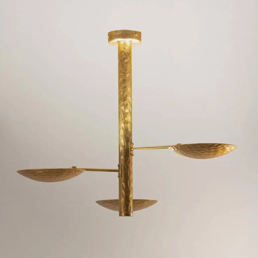 Lavish Stillux Triad ceiling lamp with a hammered golden cylindrical structure and three leaf-shaped heads emitting warm light