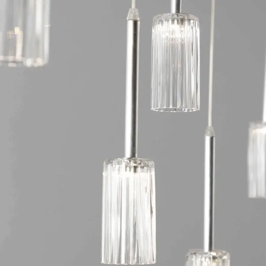 Distinguished Stillux Flow suspension lamp with clear vertically-ridged glass pendants and silver-toned metal rods creating a minimalist aesthetic