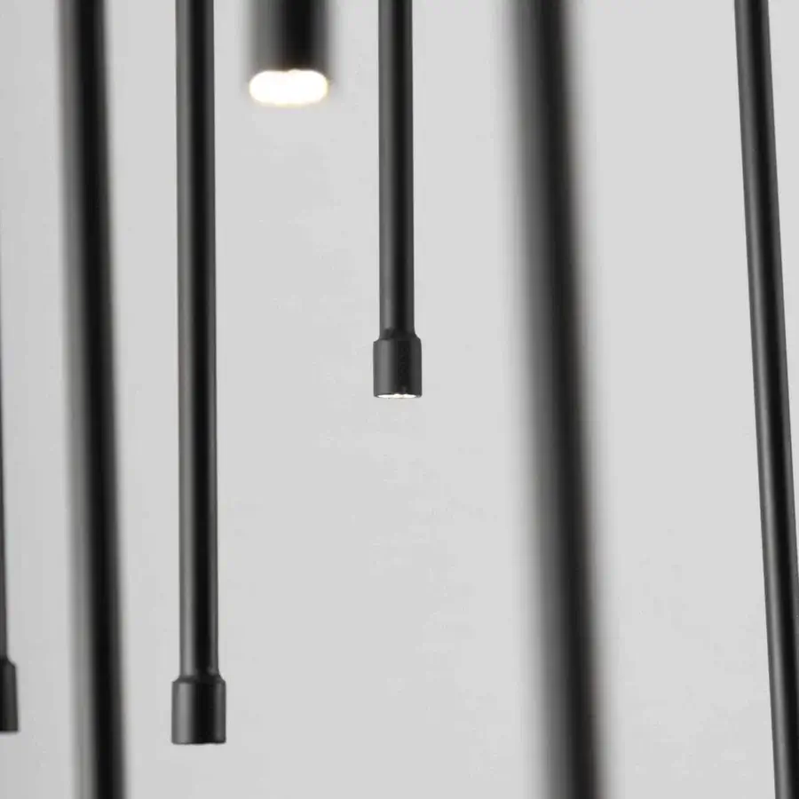Distinguished Stillux Flow suspension lamp with a circular structure and dynamic matte black metal pendants providing warm white illumination