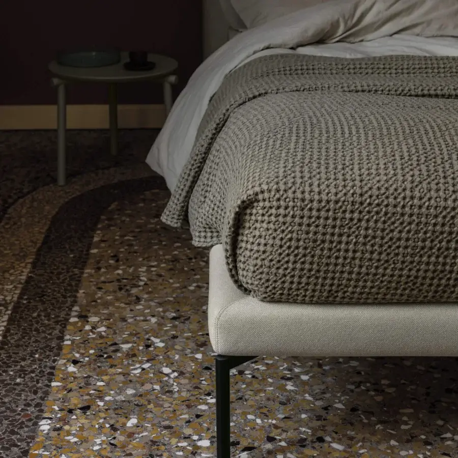 Captivating Bolzan Letti Feel bed with subtly textured light gray upholstery and slender dark metal legs
