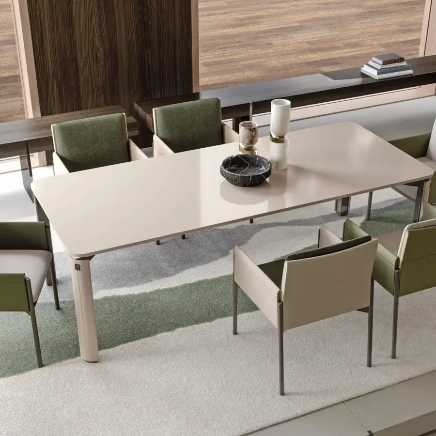 Elegant Turri Zenit table with light cream matte top and glossy lacquered wood cylindrical legs built with a metal structure