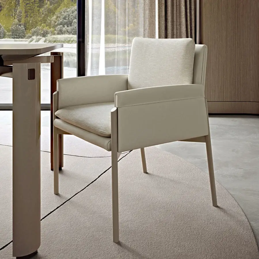 Elegant Turri Zenit armchair with light beige matte leather upholstery and sleek metal legs