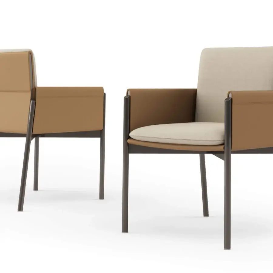 Distinguished Turri Zenit armchair with caramel-brown leather and light tan textile cushions, built with dark metal legs