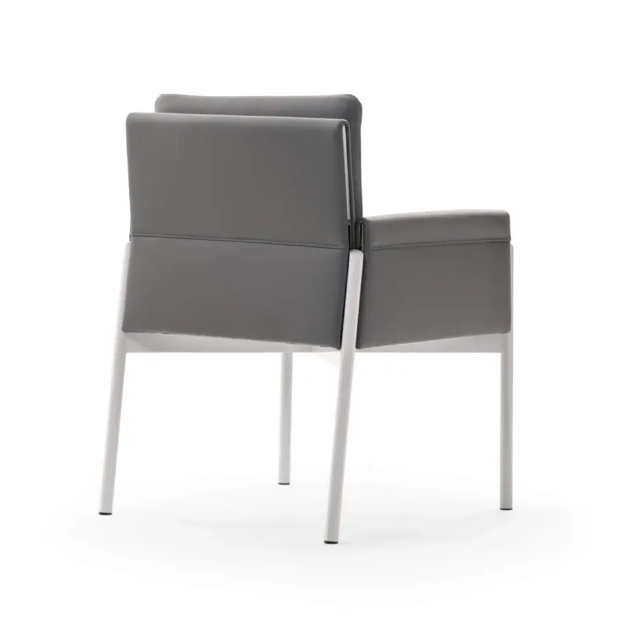 Exceptional Turri Zenit armchair with gray leather upholstery and white-finished metal legs offering comfortable support