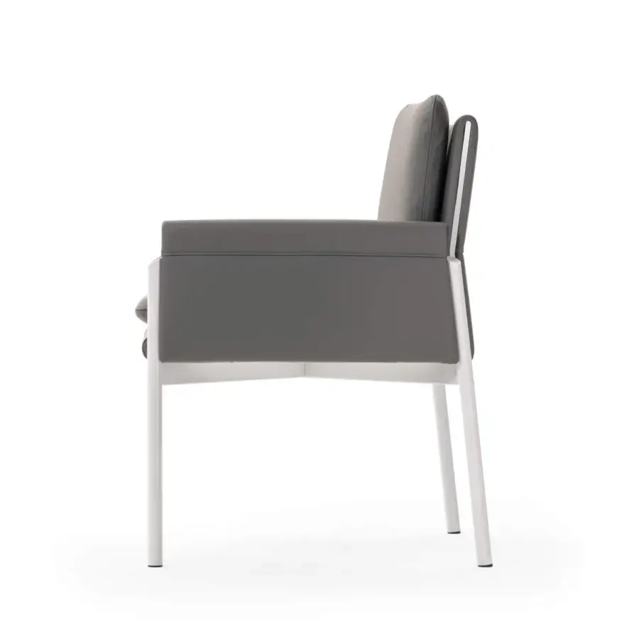 Exclusive Turri Zenit armchair with thin white metal legs and comfortable gray cushions offering a geometric silhouette
