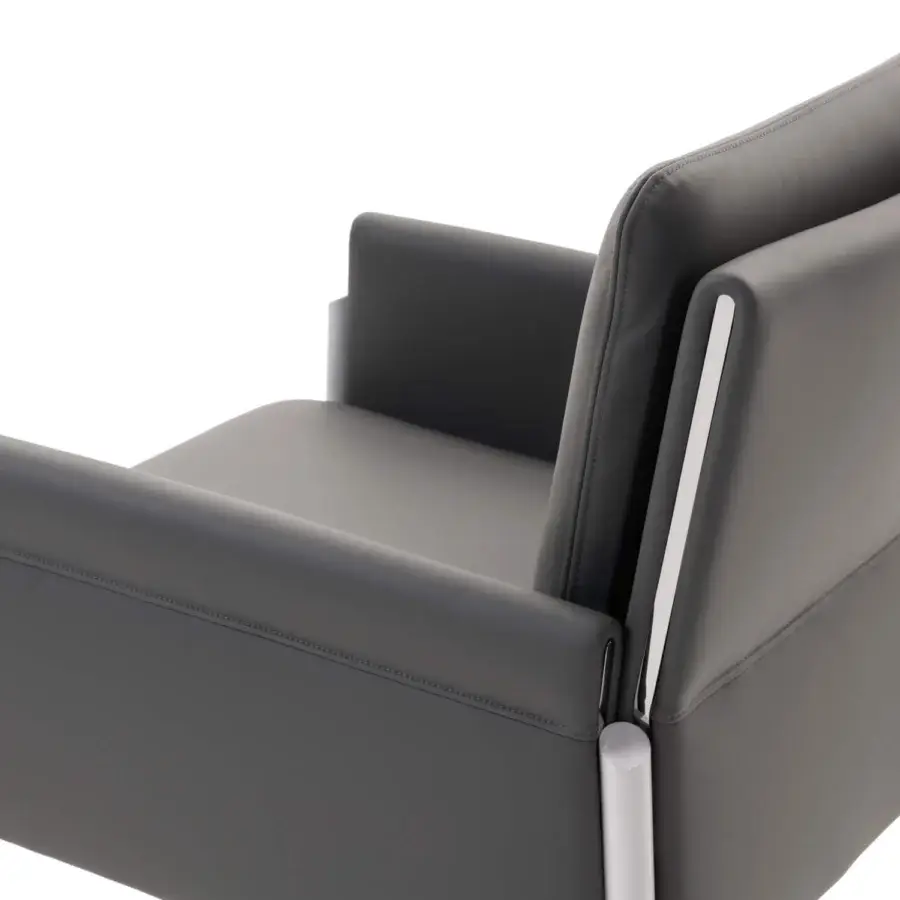 Distinguished Turri Zenit armchair with sleek metal legs and angular form in matte gray synthetic leather upholstery