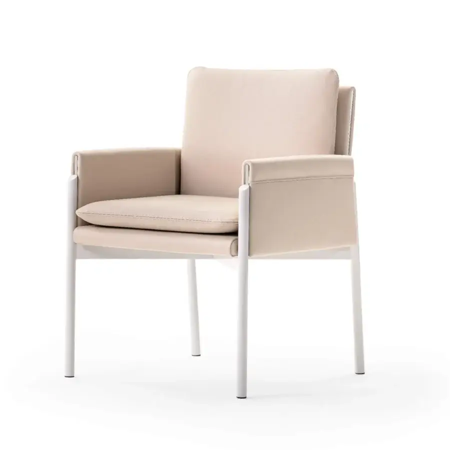 Superior Turri Zenit armchair with light beige textile and matte white metal legs offering comfortable cushions