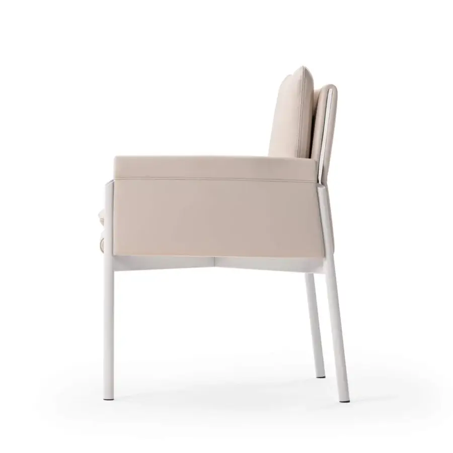 Captivating Turri Zenit armchair with light beige leather and thin metal legs supporting a cushioned structure