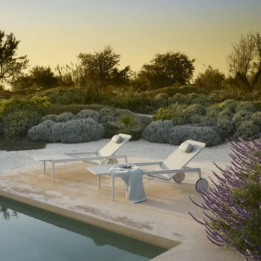 Distinguished Royal Botania Styletto lounger with light gray metal frame and matte finish, including a matching head cushion for comfort