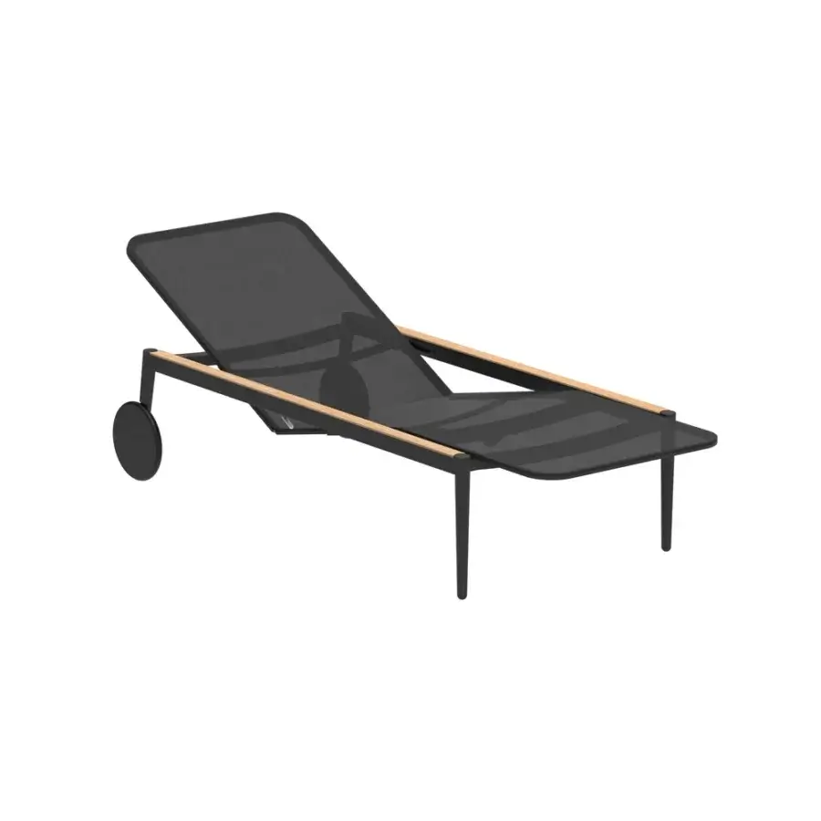 Exceptional Royal Botania Styletto lounger with matte black metal framing and dark mesh seating built with light wood accents