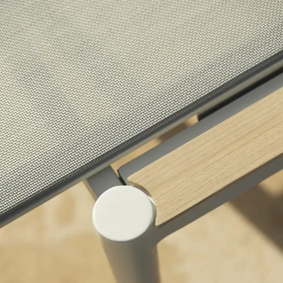 Distinguished Royal Botania Styletto lounger with light gray woven textile, light-colored wood, and matte off-white metal frame