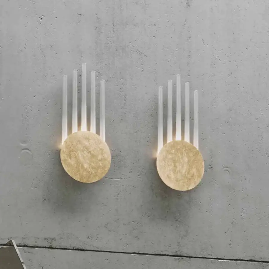 Elegant Stillux Random wall lamp with a light golden textured circular metal disc and frosted pyrex glass tubes