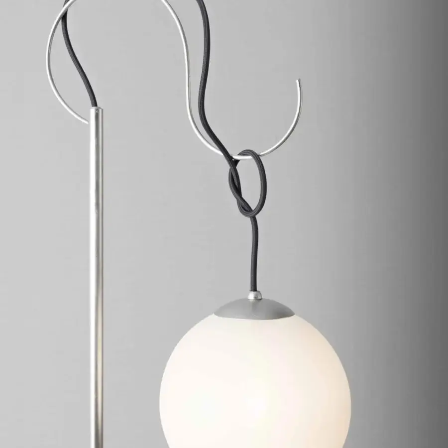 Elegant Stillux Balloons floor lamp with a slender metal rod and frosted glass sphere connected by a black cord