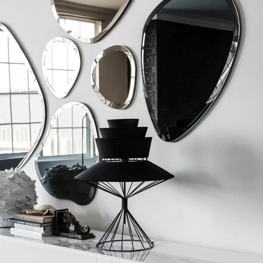 Elegant Cattelan Italia Hawaii mirror with organic shapes and beveled silver mirrored glass creating an interrupted reflection