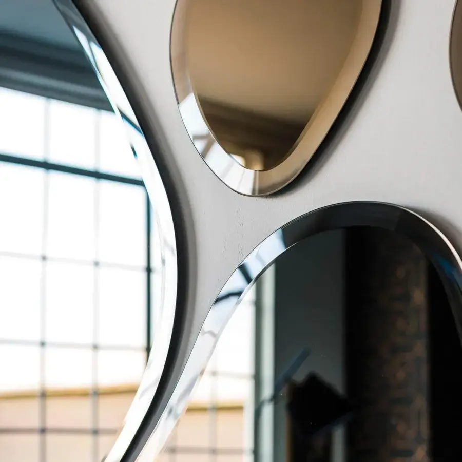 Superior Cattelan Italia Hawaii mirror with interconnected rounded segments in silver reflective surfaces and bronze accents crafted with glossy metal