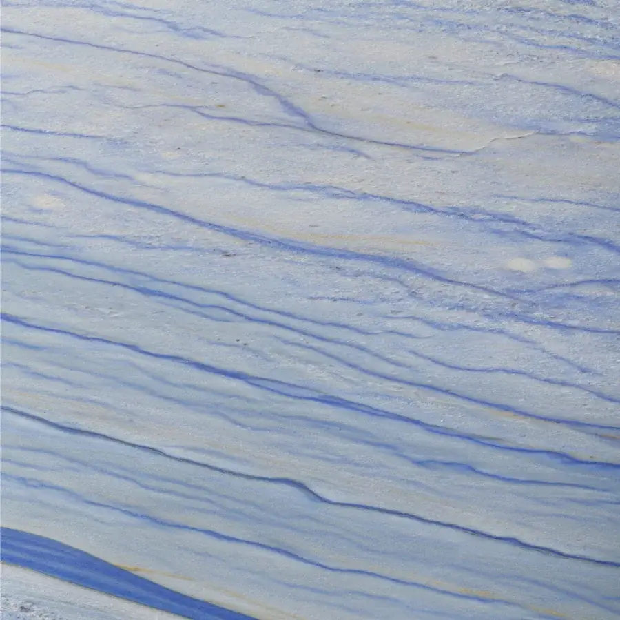 Luxury Turri Azul table with shaped marble tabletop displaying pale and deep blue veins and iridescent liquid painted metal base