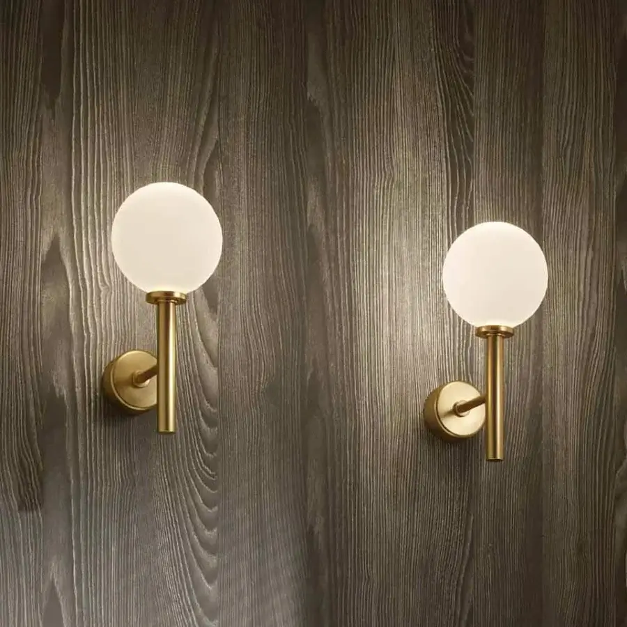 Exceptional Stillux Balloons wall lamp crafted in Italy with round matt white glass and slender golden metal frame