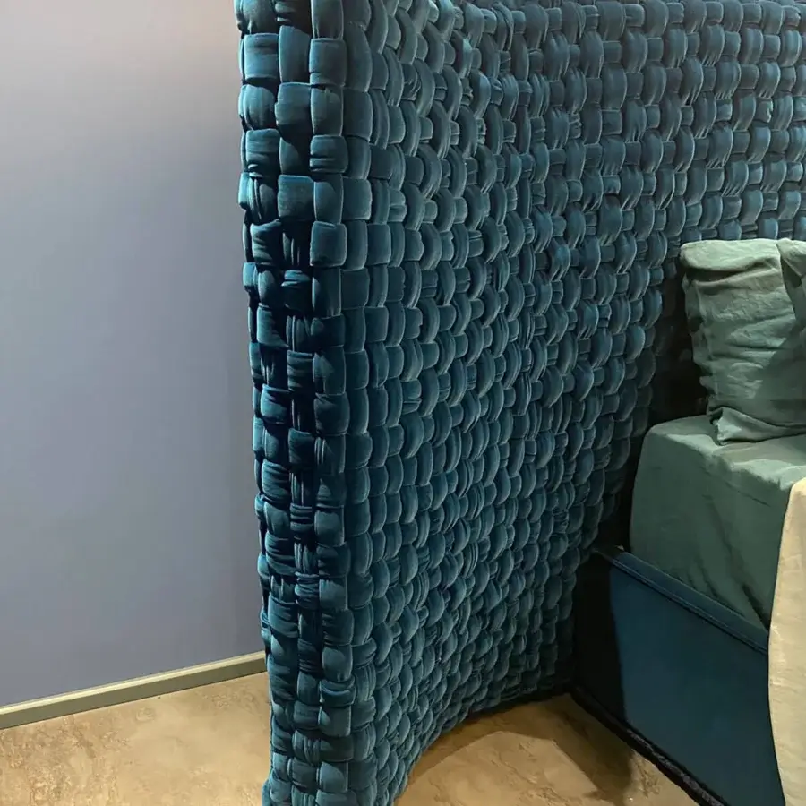 Lavish Turri Azul bed boasts a grand headboard hand-woven in deep teal velvet with quilted texture and smooth upholstery