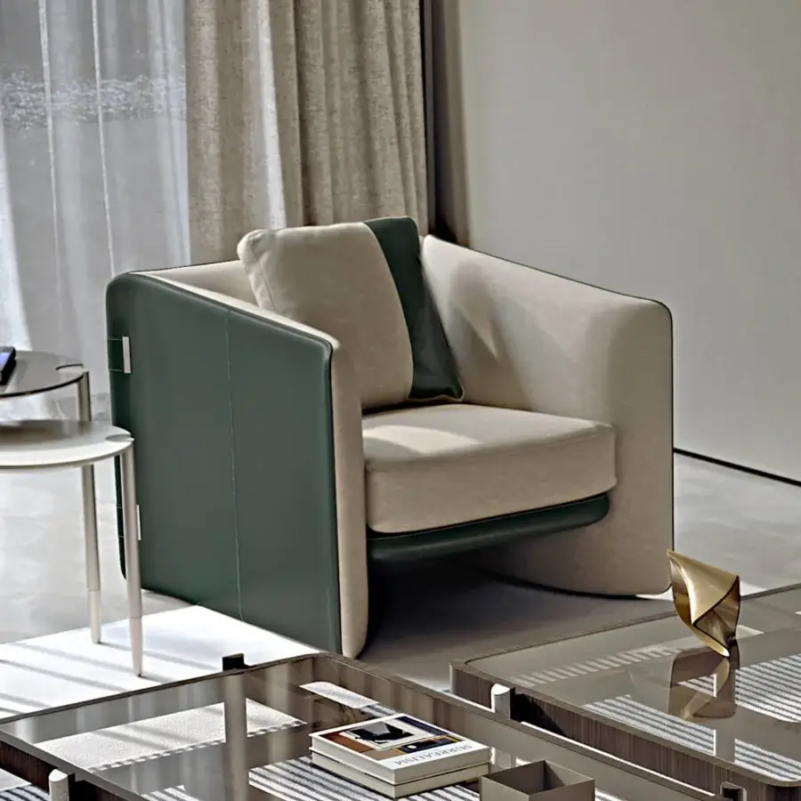 Superior Turri Blossom lounge chair with light beige textile and dark green leather upholstery, exhibiting parabolic arches with metal details