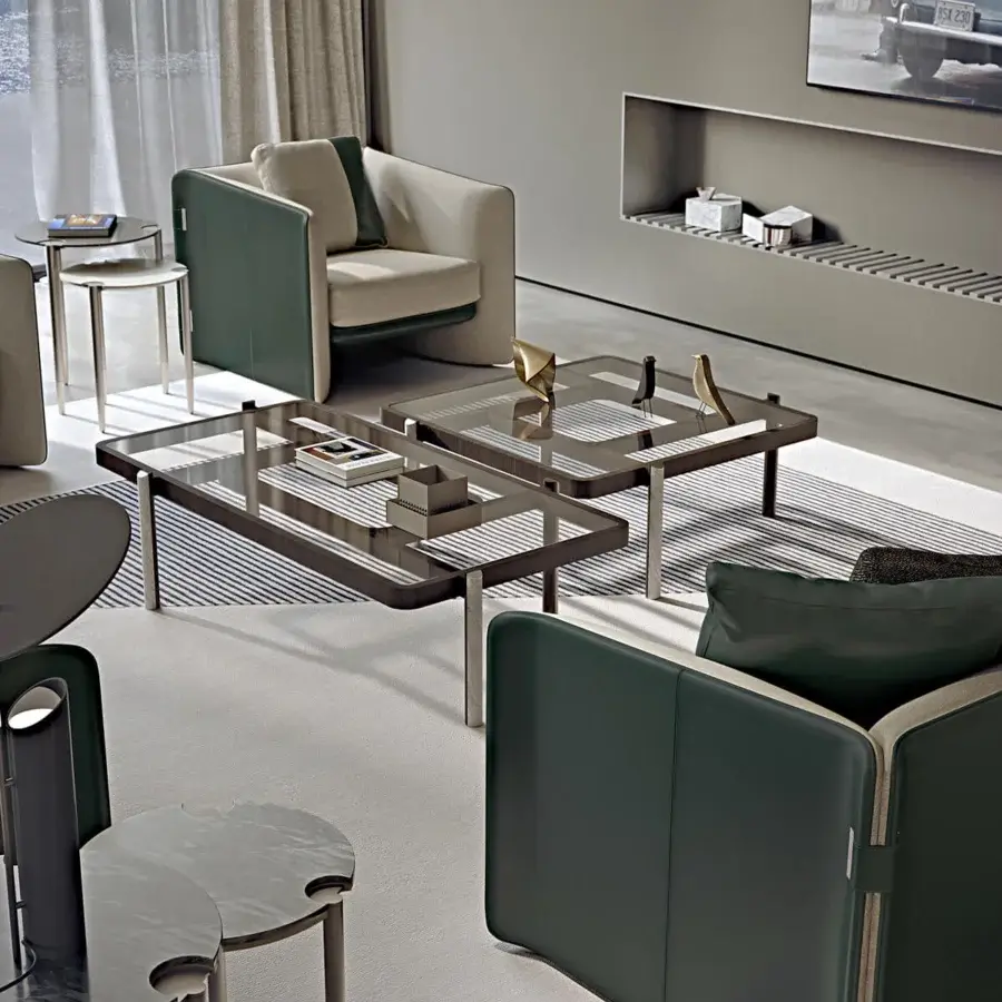 Distinguished Turri Blossom lounge chair upholstered in light beige fabric with dark green panels and metal details