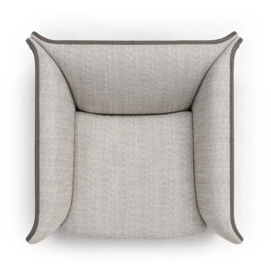 Elegant Turri Blossom lounge chair upholstered in light gray herringbone fabric with darker gray trim details
