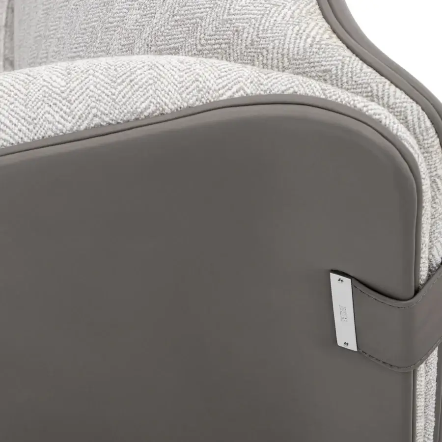 Exclusive Turri Blossom lounge chair with soft lines, parabolic arches and woven light gray herringbone upholstery with matte gray panel