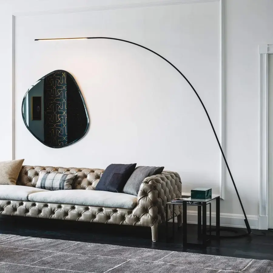 Distinguished Cattelan Italia Lampo floor lamp crafted in black embossed lacquered steel with a minimalist arcing silhouette