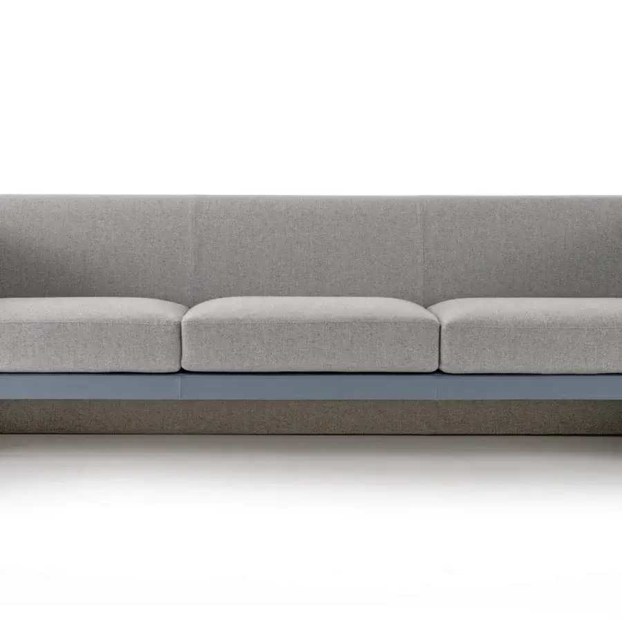 Distinguished Turri Blossom sofa with light gray textile upholstery and smooth blue-gray synthetic band at the base
