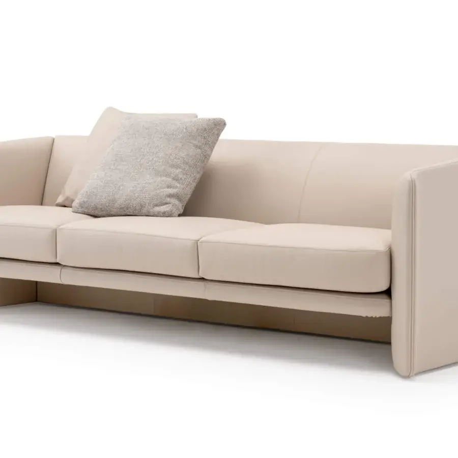 Superior Turri Blossom sofa with light beige textile upholstery, geometric silhouette and subtle metal details