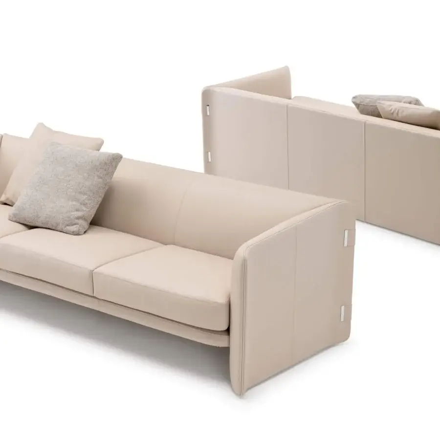 Superior Turri Blossom sofa with light beige textile upholstery, geometric forms and delicate metal embellishments