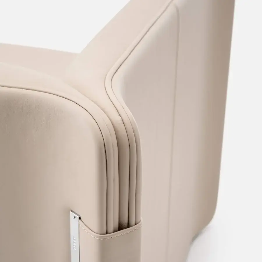 Superior Turri Blossom sofa with light beige synthetic leather upholstery and delicate metal highlighted parabolic arches