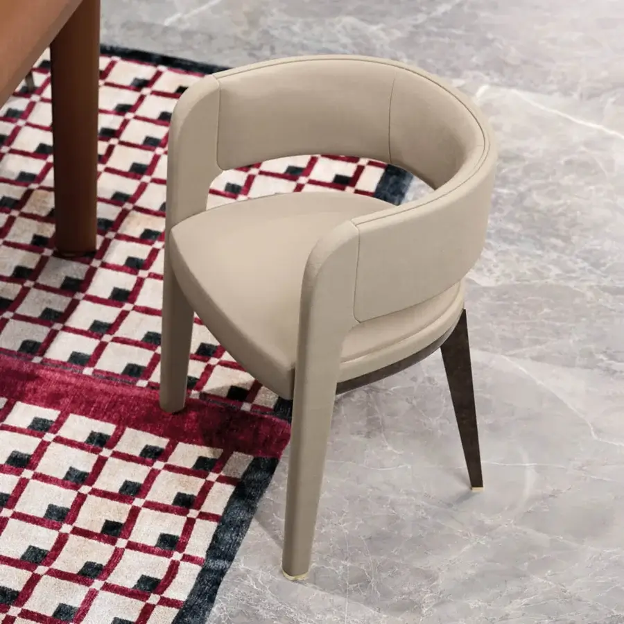 Elegant Turri Eclipse armchair with light beige textile upholstery and light gold metal accents crafted with wood legs