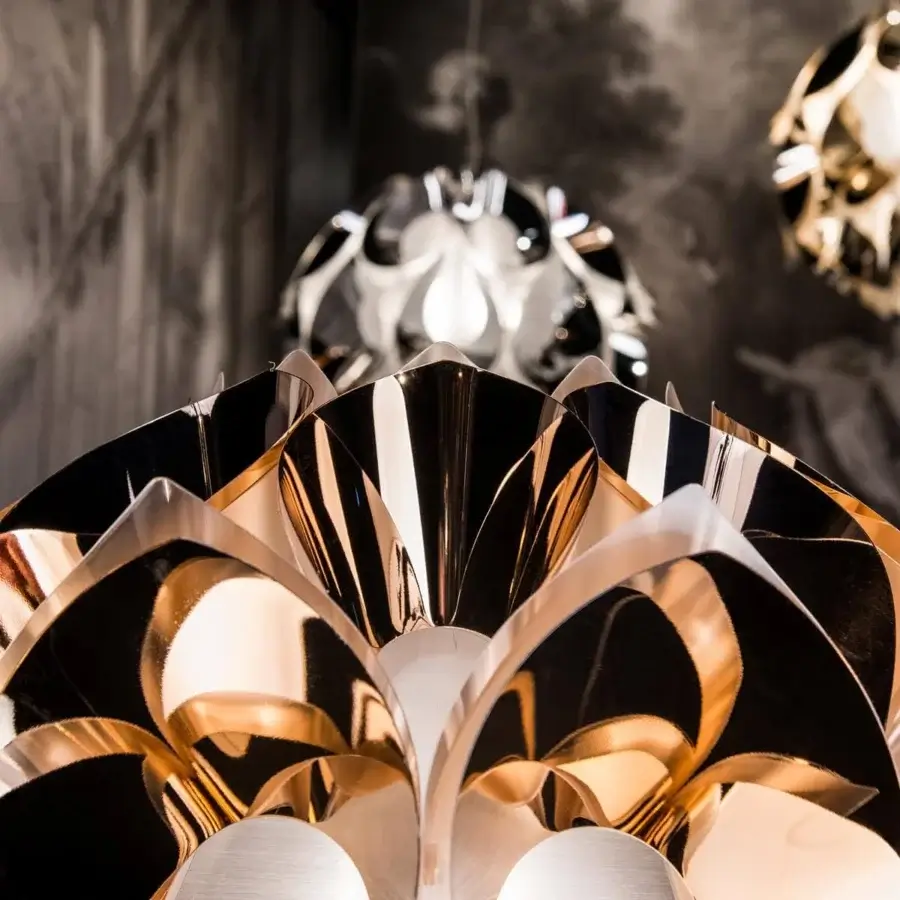 Superior Slamp Flora floor lamp with sixty petals displaying a shiny gold-toned aluminum vaporization finish