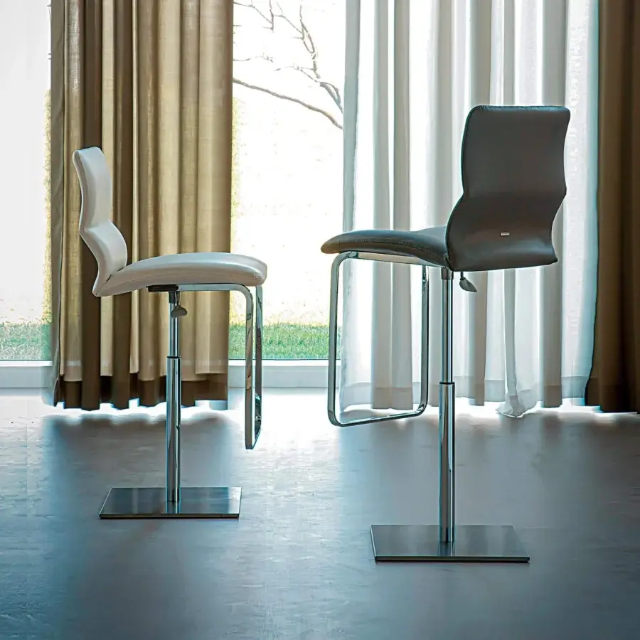 Exceptional Cattelan Italia Victor stool with subtly curved seat and leather-textured upholstery in contrasting neutral tones with chromed steel base