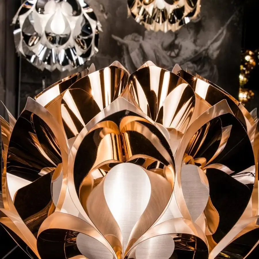 Distinguished Slamp Flora floor lamp with sixty petal-shaped elements in a shiny gold finish evoking sunlight reflections