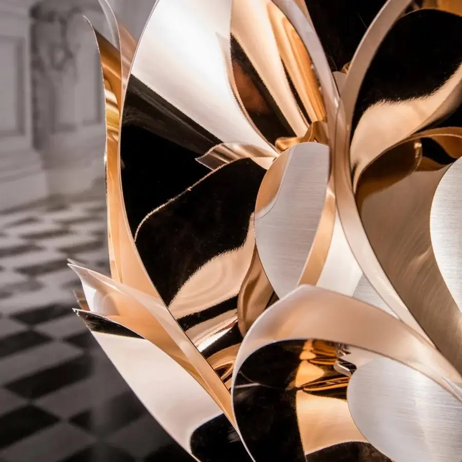 Innovative Slamp Flora floor lamp with sixty copper-toned petals and a lustrous reflective metal finish