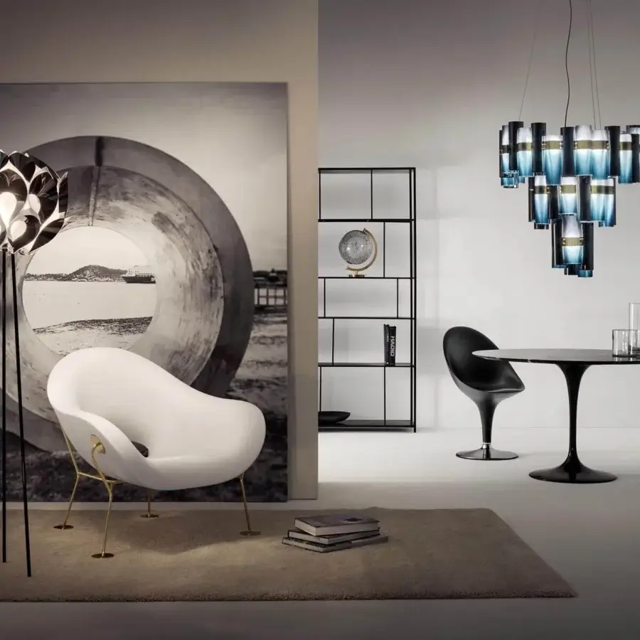 Exceptional Slamp Flora floor lamp with sixty petal-shaped pieces and slender dark metal legs emitting a sophisticated glow