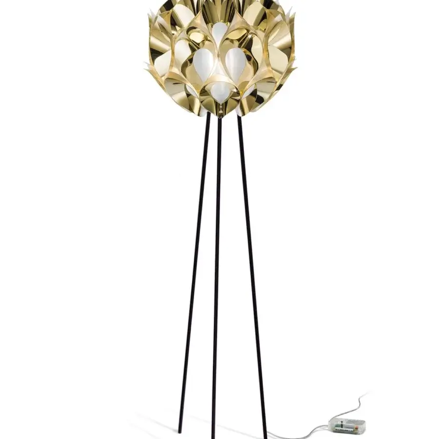 Innovative Slamp Flora floor lamp crafted with layered aluminum petals in gold and a shiny reflective finish with matte black legs