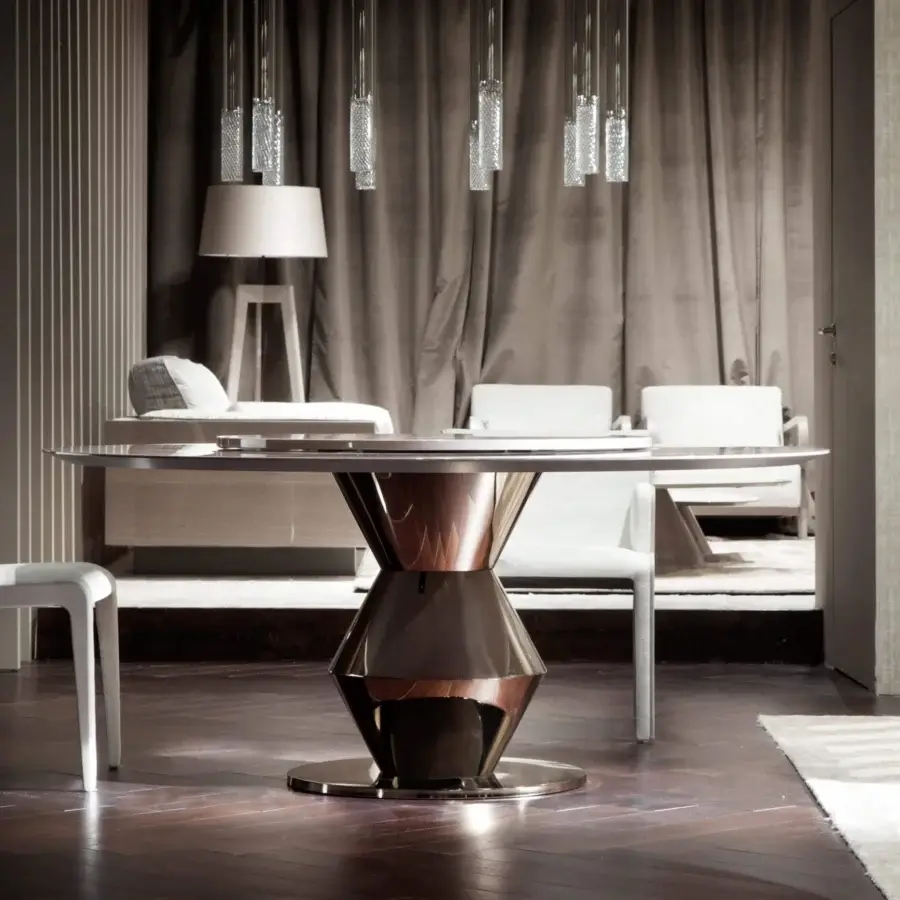 Distinguished Costantini Pietro Grand Palais table with a round glass tabletop and dark reflective bronze metal base crafted in Italy