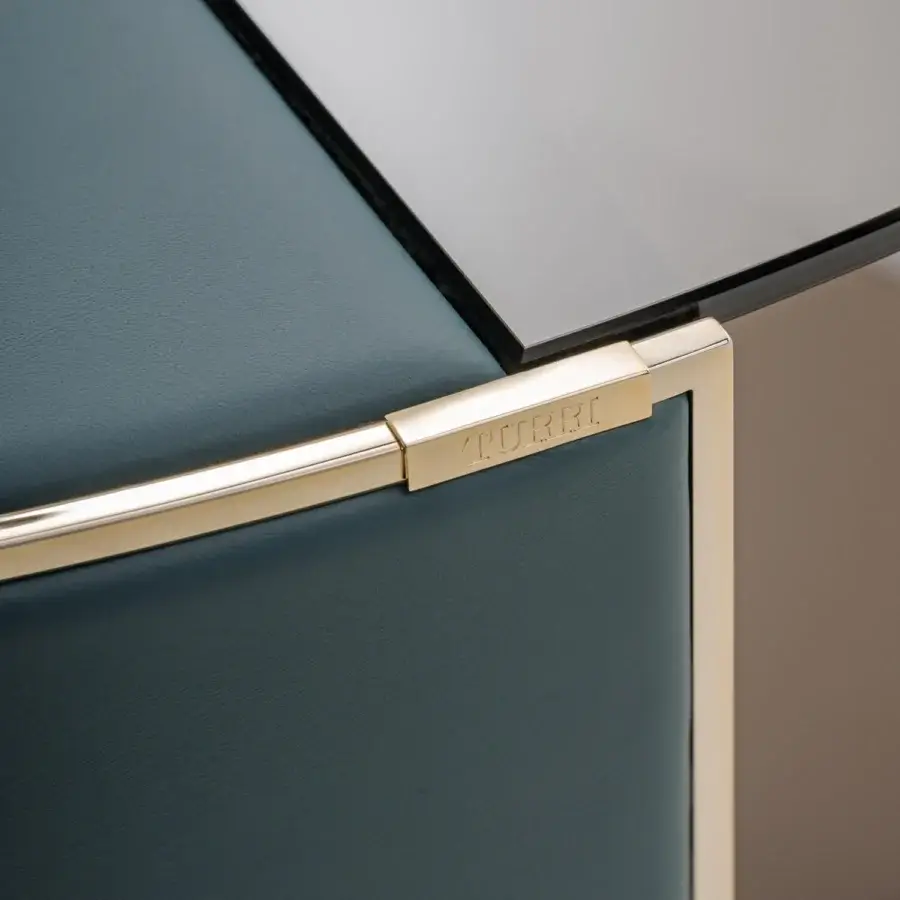 Superior Turri Eclipse coffee table with dark teal leather, bronzed glass, and lustrous gold metal detailing