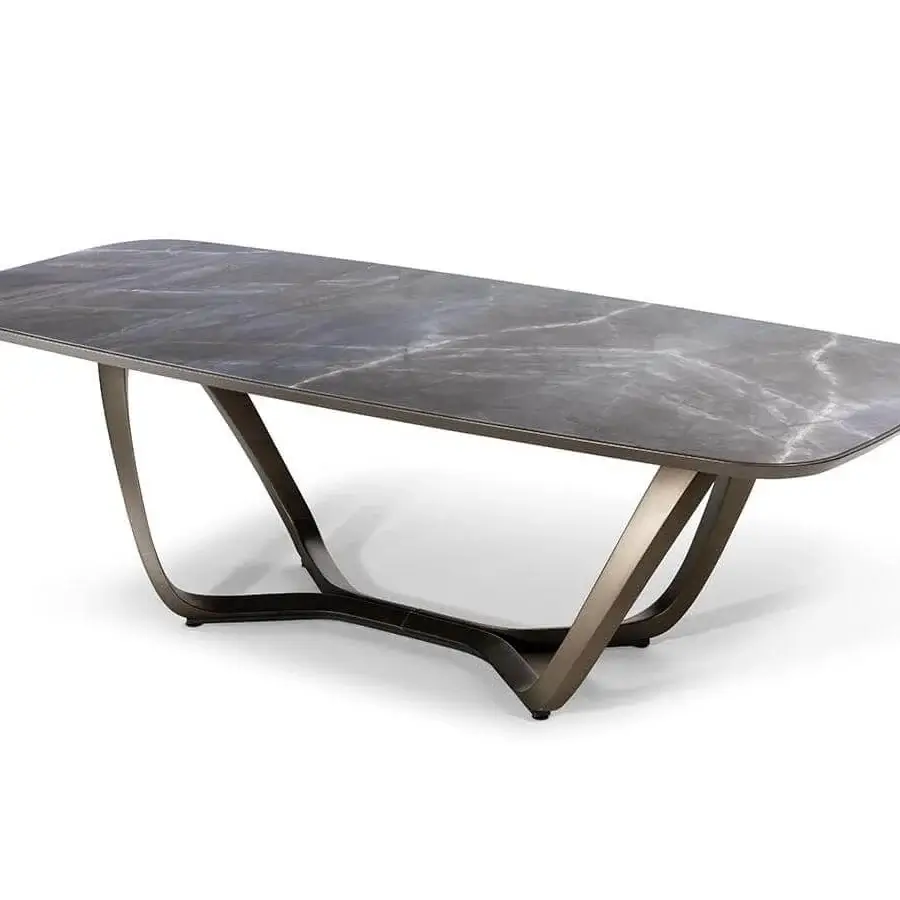 Elegant Reflex Segno table with cool gray marble-like top and bronze metal base crafted with dynamic angled legs