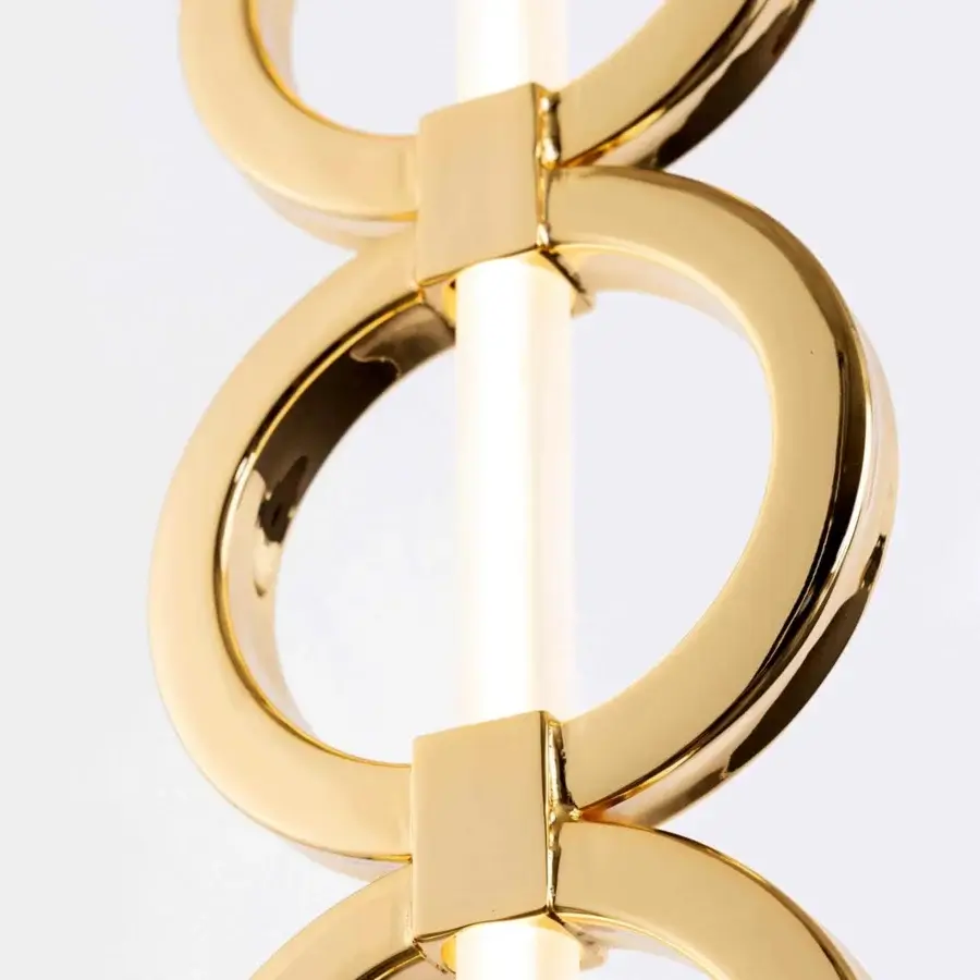 Captivating Stillux Chain suspension lamp with gold metal rings and frosted pyrex glass tube, exhibiting a glossy finish