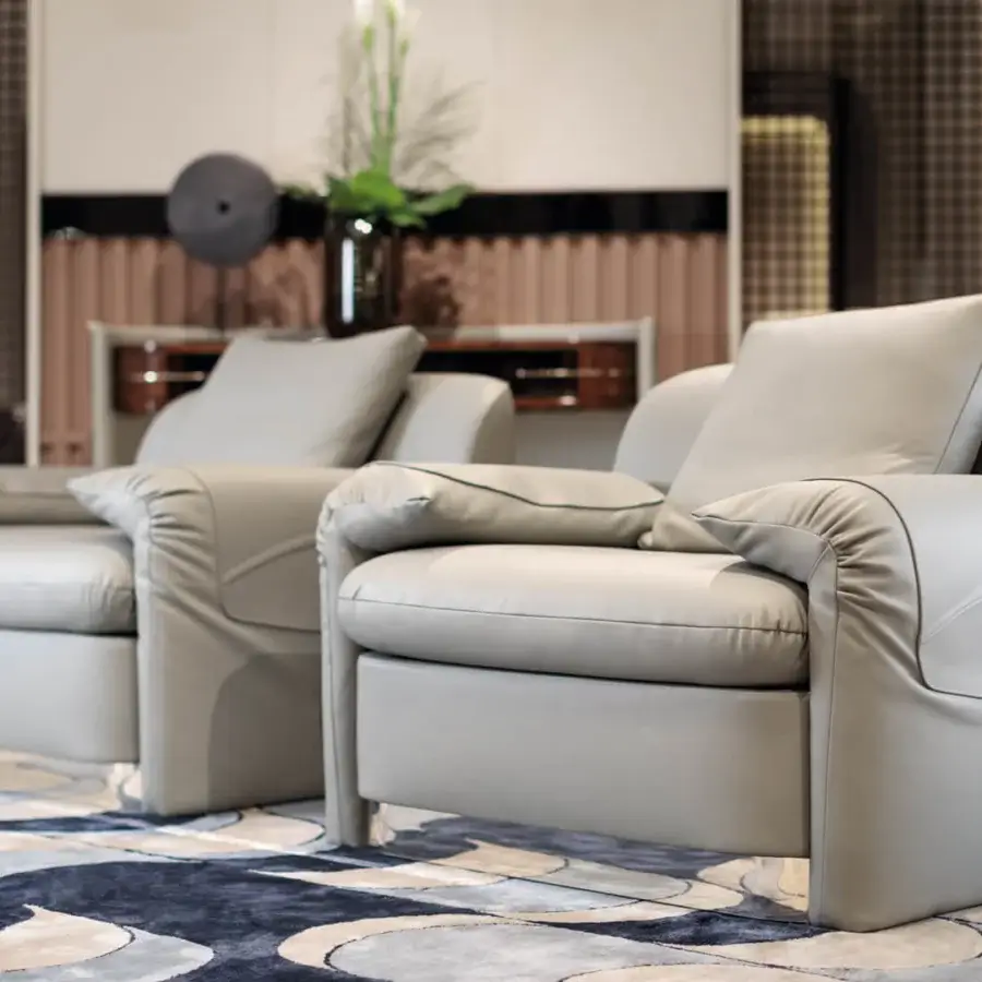 Exceptional Turri Eclipse lounge chair with light gray leather upholstery and light gold metal details