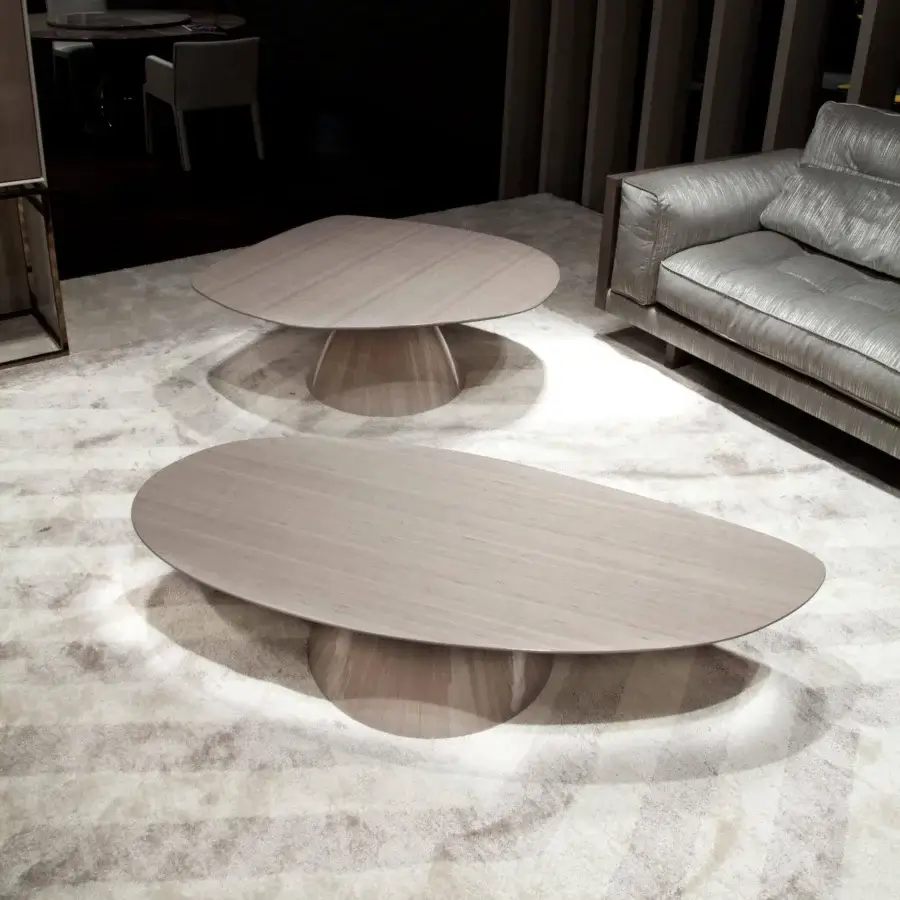 Distinguished Costantini Pietro Chelsea and Tribeca coffee tables with curved lines and matte Castagno Toscano finish in a warm gray hue