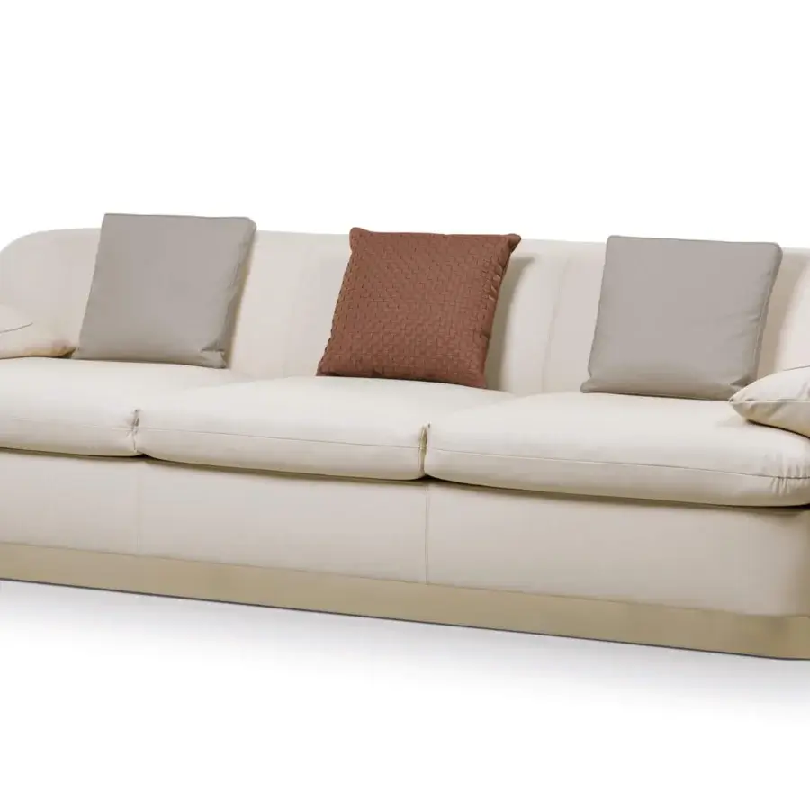 Lavish Turri Eclipse sofa with sinuous lines, inward folded armrests and light beige textile upholstery with light gold metal details