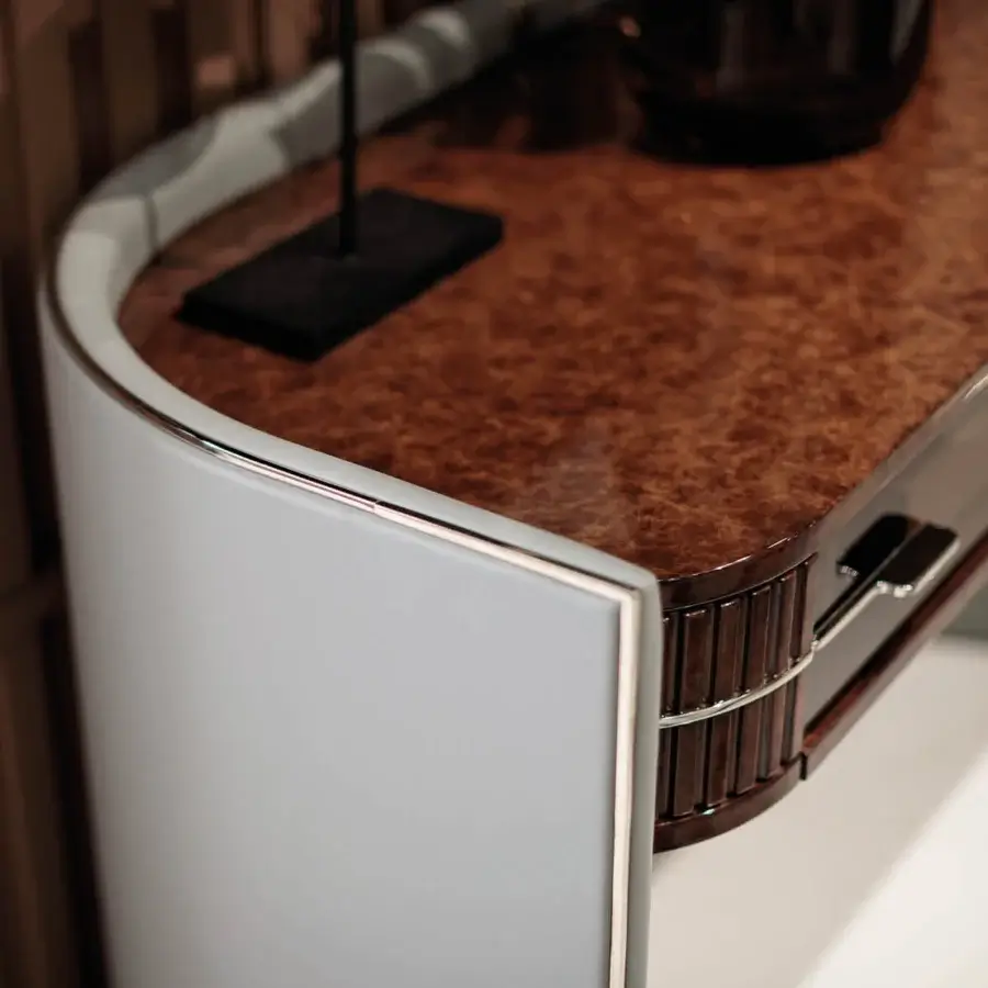 Superior Turri Eclipse console with a semi-circular light gray leather exterior and mottled brown glossy lacquered wood
